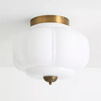 Szklana lampa sufitowa w kolorze jadeitowej zieleni z złotą ramą